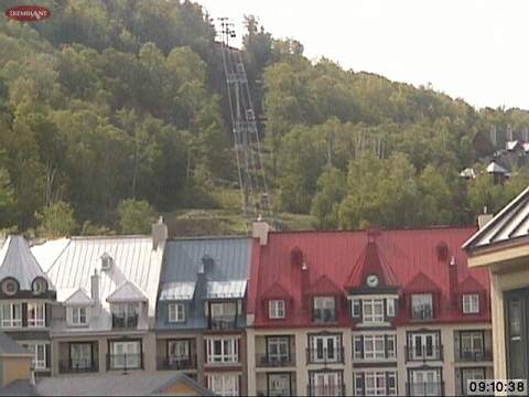 Looking across the roof tops of Le Sommet des Neiges, we can see the Casino Gondola cable with cars attached now.