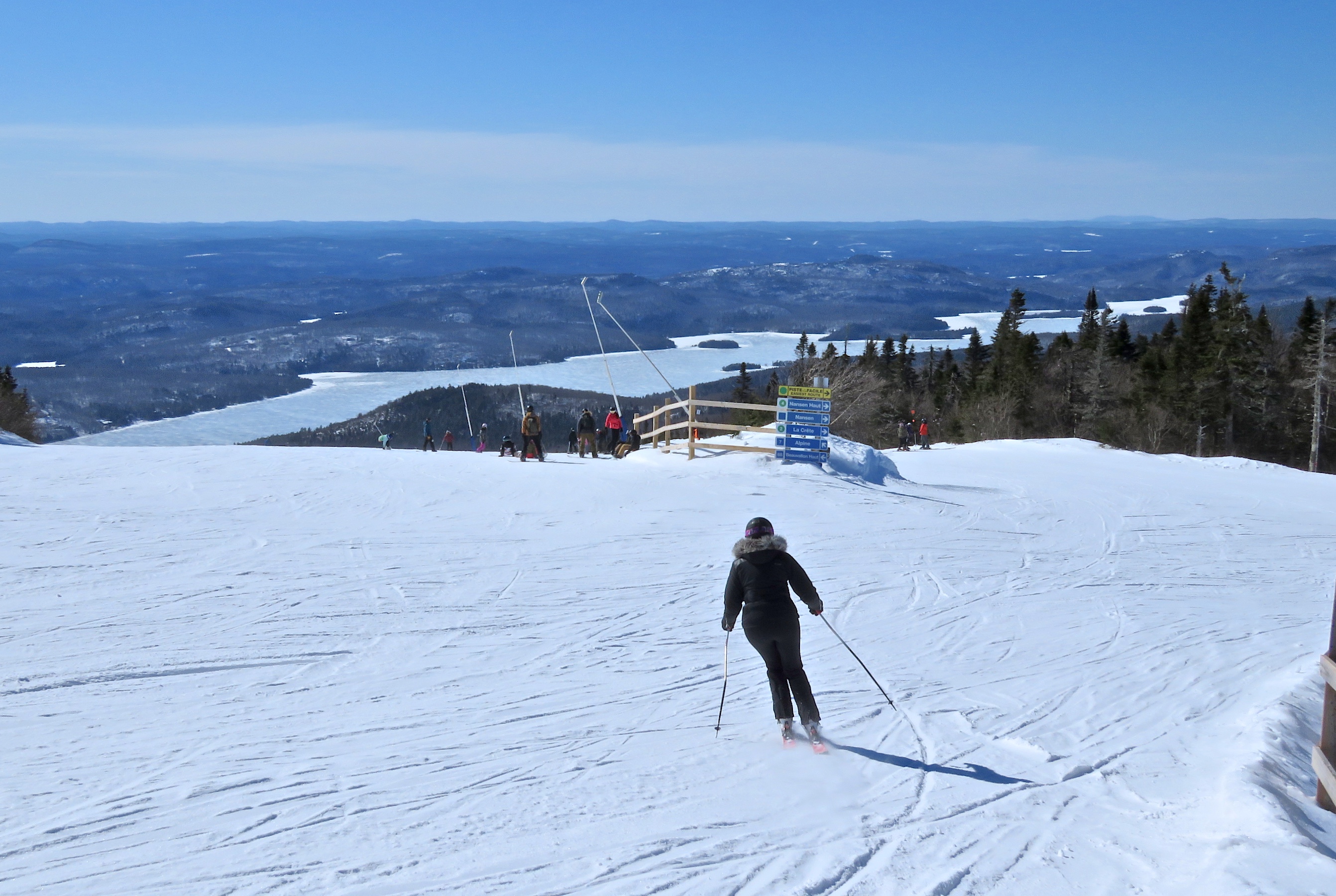 4.2.23.Summit.La.Crete.POV.over.Beauvallon.Lac.T.Skis.Into.Frame.Parallel.Style.c.jpg